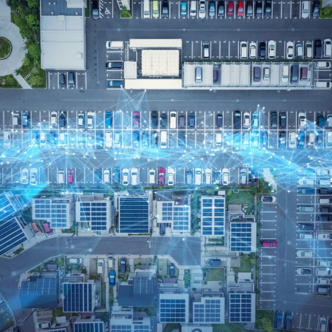 Foto von Digitalisierung über einem Parkplatz