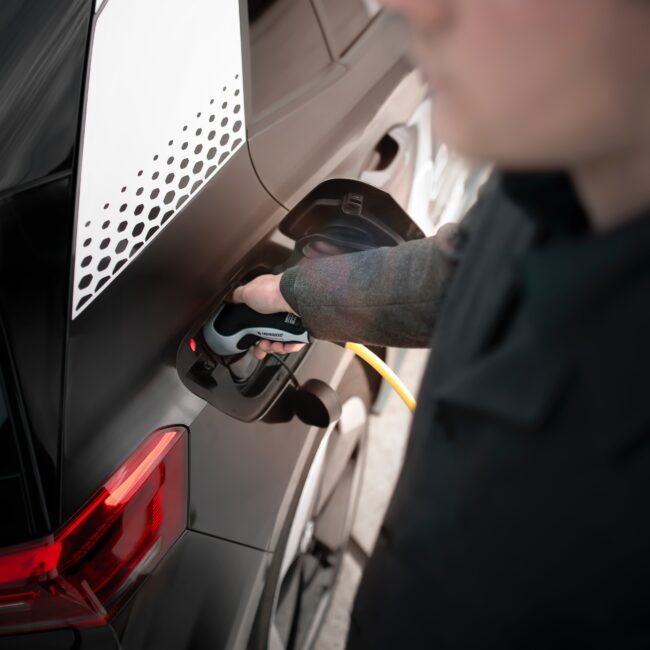 Man charging electric car